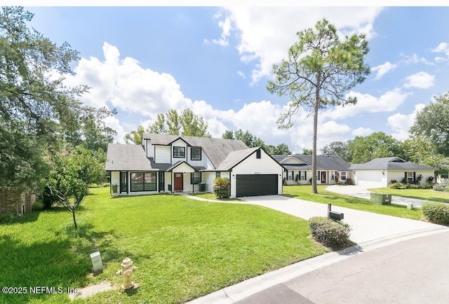 8820 Bandera Cir S, Jacksonville, FL 32244 - view of front facade with a garage, concrete driveway, and a front yard