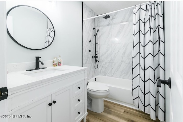 8820 Bandera Cir S, Jacksonville, FL 32244 - bathroom with vanity, shower / tub combo with curtain, and wood finished floors