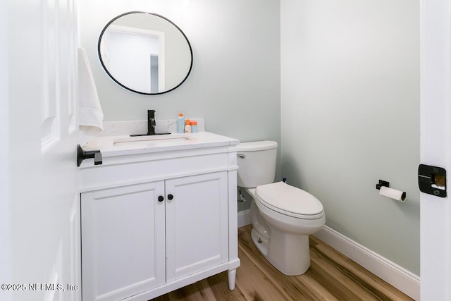 8820 Bandera Cir S, Jacksonville, FL 32244 - half bathroom with vanity and wood finished floors