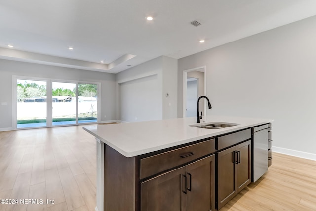 85448 Sandy Ridge Loop Unit 0049, Yulee, FL 32097 - kitchen with open floor plan, light countertops, light wood-style floors, a kitchen island with sink, and dishwasher