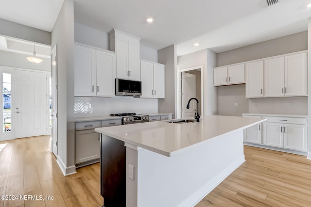 85448 Sandy Ridge Loop Unit 0049, Yulee, FL 32097 - kitchen featuring stainless steel appliances, light wood-style floors, recessed lighting, and tasteful backsplash