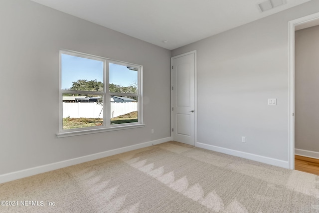 85448 Sandy Ridge Loop Unit 0049, Yulee, FL 32097 - unfurnished bedroom with baseboards and carpet floors