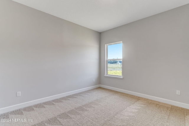 85448 Sandy Ridge Loop Unit 0049, Yulee, FL 32097 - unfurnished room featuring baseboards and light carpet