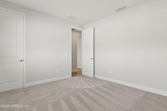 85448 Sandy Ridge Loop Unit 0049, Yulee, FL 32097 - unfurnished bedroom featuring carpet flooring and baseboards