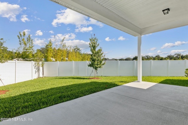 85448 Sandy Ridge Loop Unit 0049, Yulee, FL 32097 - fenced backyard with a patio area