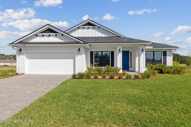 85448 Sandy Ridge Loop Unit 0049, Yulee, FL 32097 - modern farmhouse with a garage, driveway, board and batten siding, and a front yard