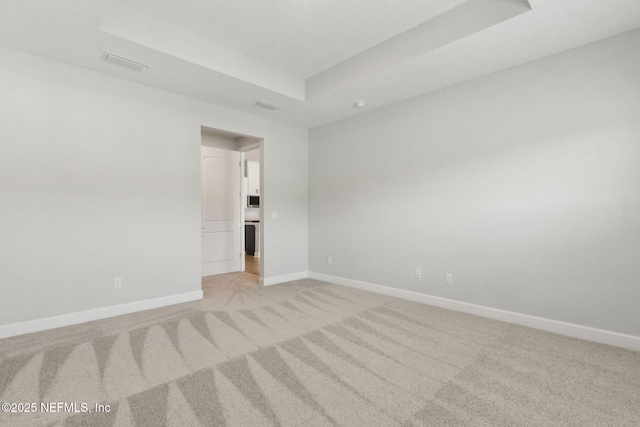 85448 Sandy Ridge Loop Unit 0049, Yulee, FL 32097 - unfurnished room featuring a tray ceiling and light carpet