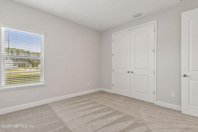 85448 Sandy Ridge Loop Unit 0049, Yulee, FL 32097 - unfurnished bedroom with carpet floors and a closet