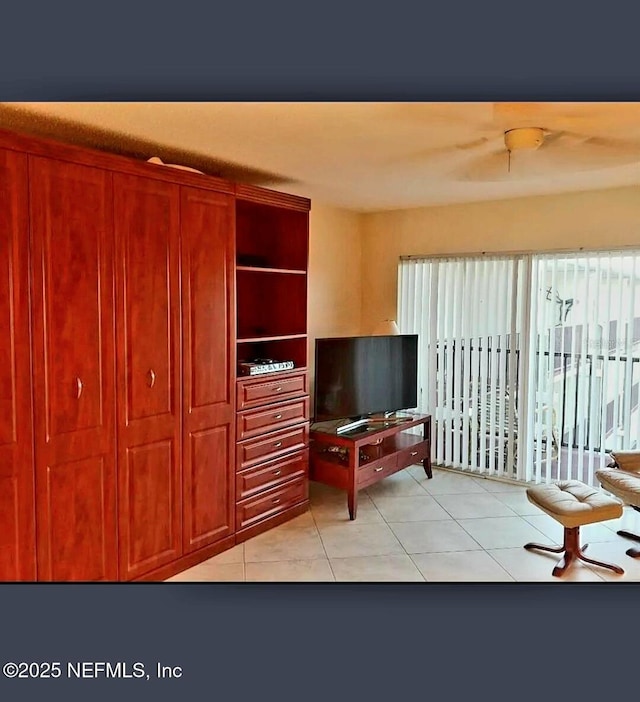 3700 Atlantic Ave Unit 405, New Smyrna Beach, FL 32169 - living room featuring light tile patterned floors