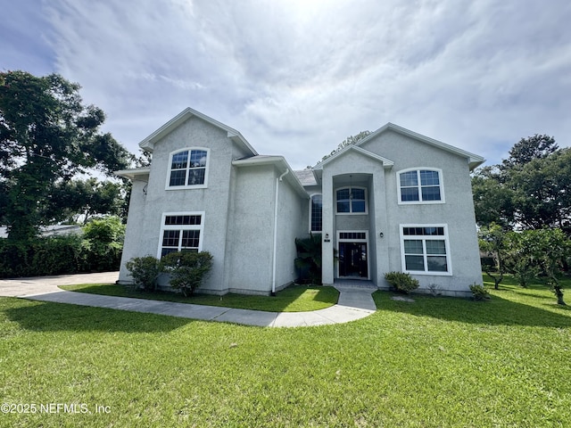 1571 Lemonwood Rd, Saint Johns, FL 32259 - traditional-style home with a front lawn and stucco siding