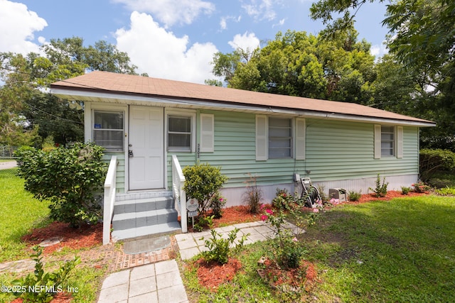 3303 Jones St, Jacksonville, FL 32206 - view of front of house with entry steps and a front yard