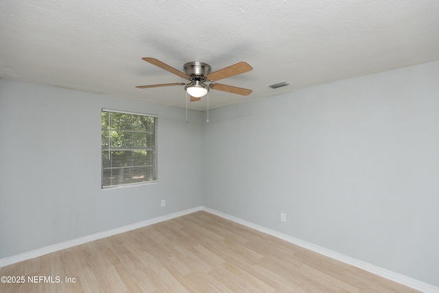 3303 Jones St, Jacksonville, FL 32206 - unfurnished room with light wood-style flooring, a ceiling fan, and a textured ceiling