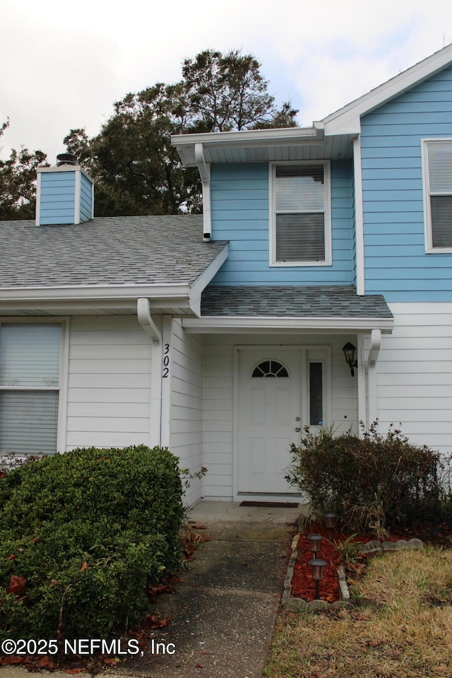 791 Assisi Ln Unit 302, Jacksonville, FL 32233 - property entrance featuring a chimney