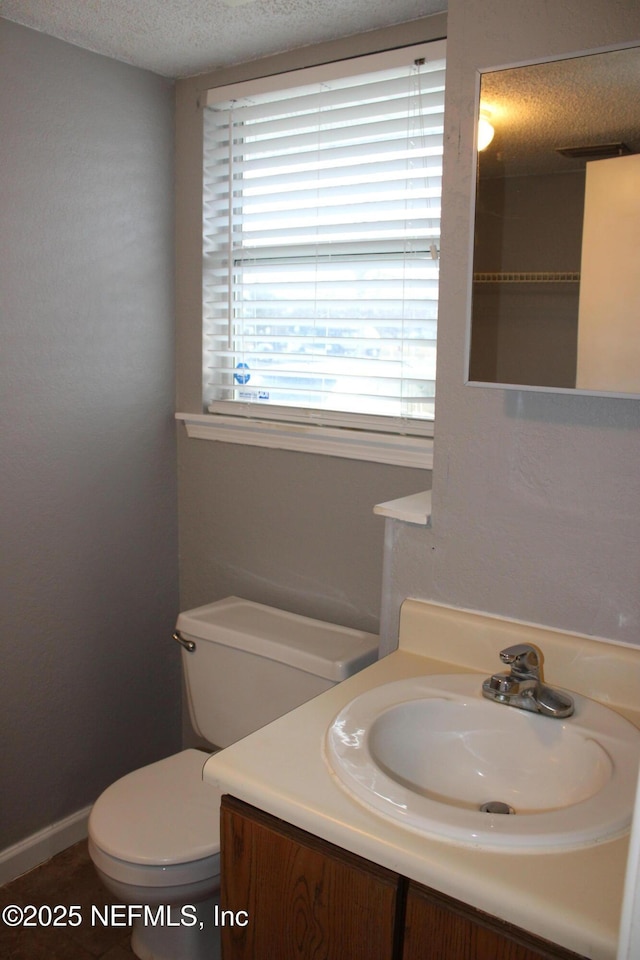 791 Assisi Ln Unit 302, Jacksonville, FL 32233 - bathroom featuring a textured ceiling and vanity
