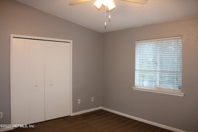 791 Assisi Ln Unit 302, Jacksonville, FL 32233 - unfurnished bedroom featuring a closet, a textured ceiling, and ceiling fan