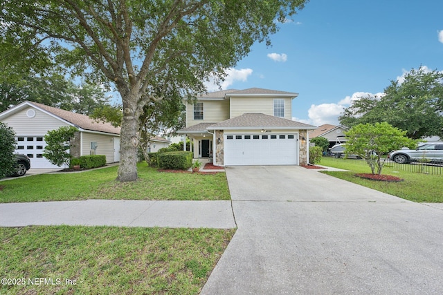 96016 Gray Heron Ct, Yulee, FL 32097 - traditional home with an attached garage, a front lawn, concrete driveway, and stone siding