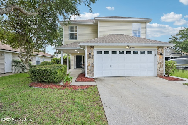 96016 Gray Heron Ct, Yulee, FL 32097 - traditional-style home featuring stone siding, concrete driveway, a garage, and a front yard