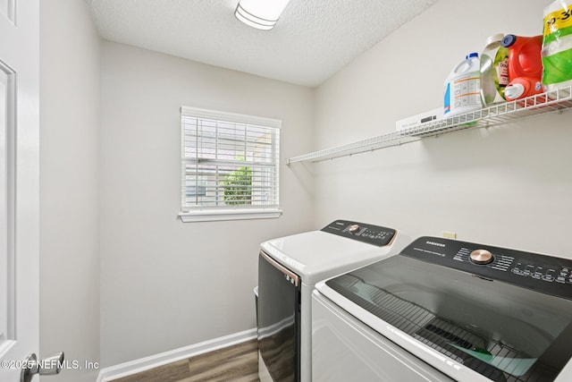 96016 Gray Heron Ct, Yulee, FL 32097 - washroom featuring washer and clothes dryer, wood finished floors, and a textured ceiling