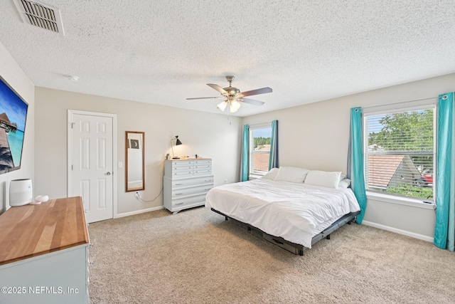 96016 Gray Heron Ct, Yulee, FL 32097 - bedroom with carpet floors, a textured ceiling, and ceiling fan