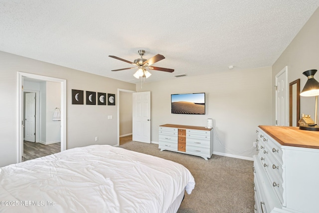 96016 Gray Heron Ct, Yulee, FL 32097 - carpeted bedroom with a textured ceiling and a ceiling fan
