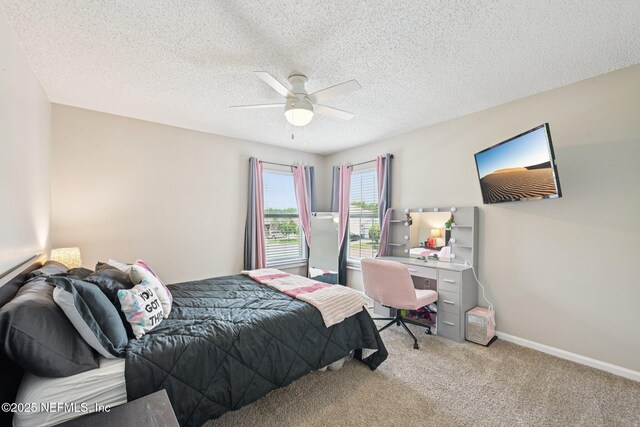 96016 Gray Heron Ct, Yulee, FL 32097 - bedroom with light colored carpet, a textured ceiling, and ceiling fan