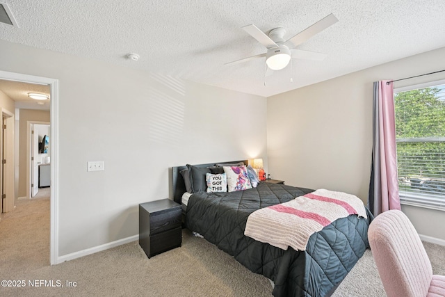 96016 Gray Heron Ct, Yulee, FL 32097 - bedroom with light colored carpet, a textured ceiling, and a ceiling fan