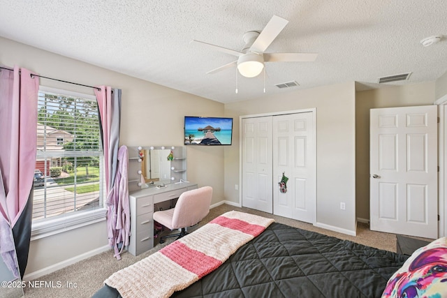 96016 Gray Heron Ct, Yulee, FL 32097 - bedroom featuring carpet, a closet, an office area, a textured ceiling, and a ceiling fan