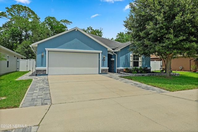 15067 Durbin Cove Way, Jacksonville, FL 32259 - ranch-style home featuring stone siding, stucco siding, a garage, and concrete driveway