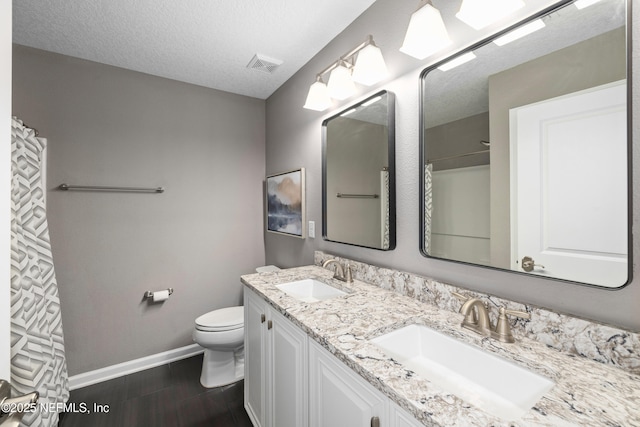 15067 Durbin Cove Way, Jacksonville, FL 32259 - full bathroom featuring double vanity, wood finished floors, a textured ceiling, and curtained shower