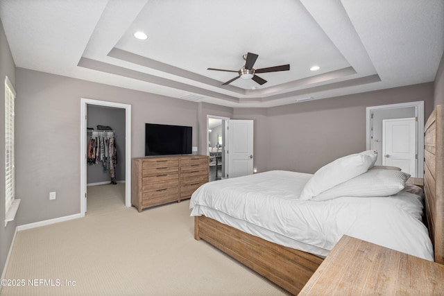 15067 Durbin Cove Way, Jacksonville, FL 32259 - bedroom with a raised ceiling, a spacious closet, light carpet, a closet, and a ceiling fan