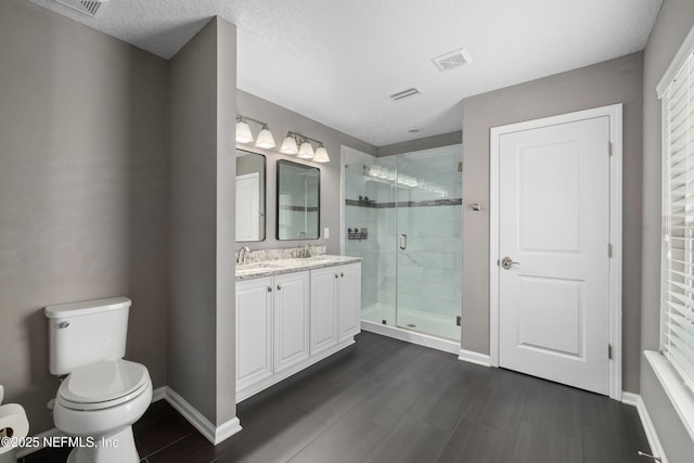 15067 Durbin Cove Way, Jacksonville, FL 32259 - bathroom featuring double vanity, a stall shower, and wood finished floors