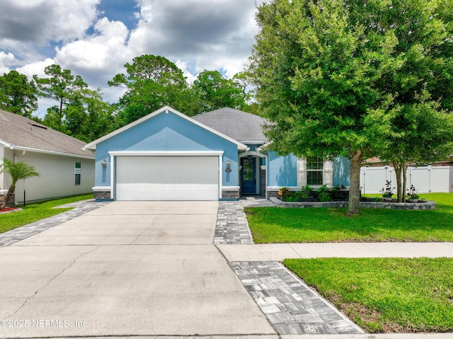 15067 Durbin Cove Way, Jacksonville, FL 32259 - single story home featuring an attached garage, driveway, stone siding, and stucco siding