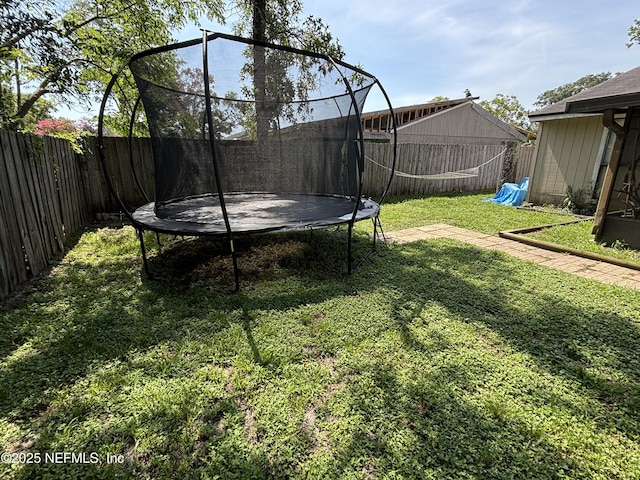 3112 Hampstead Dr, Jacksonville, FL 32225 - fenced backyard with a trampoline
