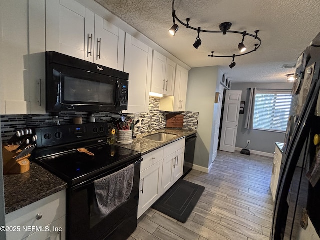 3112 Hampstead Dr, Jacksonville, FL 32225 - kitchen featuring black appliances, a textured ceiling, white cabinetry, decorative backsplash, and dark stone counters