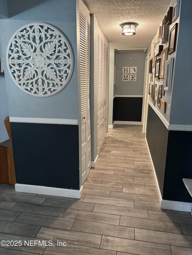 3112 Hampstead Dr, Jacksonville, FL 32225 - hall featuring a textured ceiling and light wood finished floors