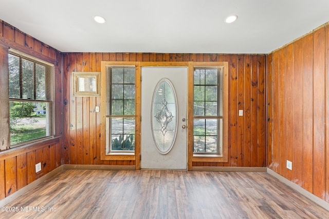 610 Division St, Fernandina Beach, FL 32034 - entryway featuring wood walls, wood finished floors, and recessed lighting
