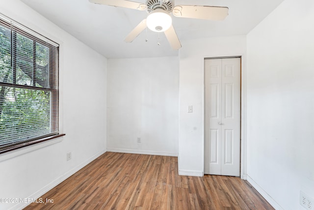 610 Division St, Fernandina Beach, FL 32034 - unfurnished room featuring wood finished floors, healthy amount of natural light, and ceiling fan
