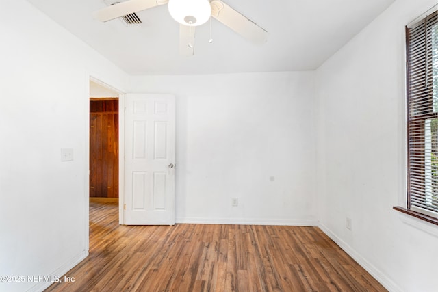 610 Division St, Fernandina Beach, FL 32034 - spare room featuring wood finished floors and a ceiling fan