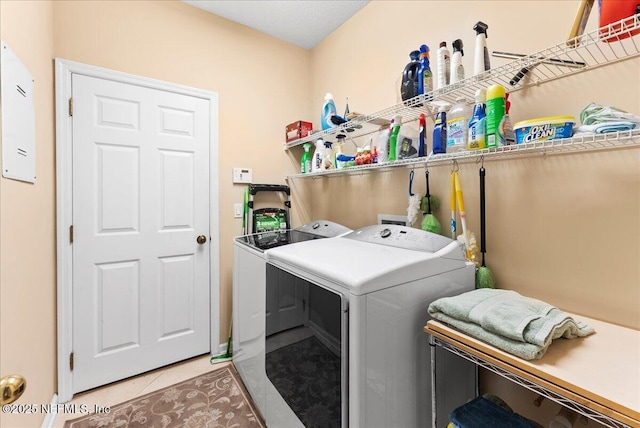 85339 Amagansett Dr, Fernandina Beach, FL 32034 - laundry room featuring washer and dryer and tile patterned floors
