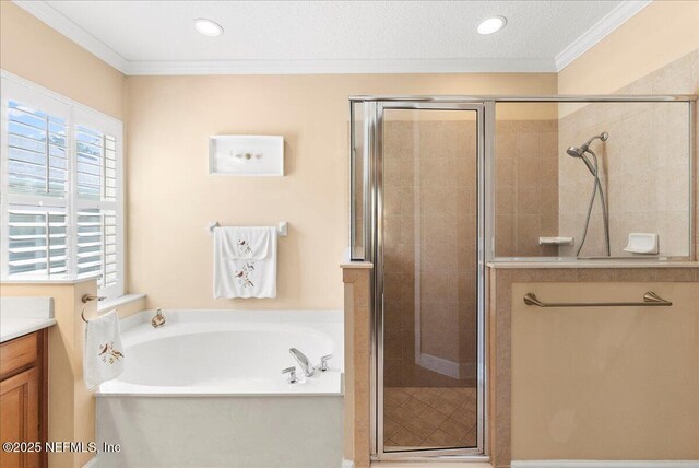 85339 Amagansett Dr, Fernandina Beach, FL 32034 - full bathroom featuring vanity, ornamental molding, a garden tub, a stall shower, and recessed lighting