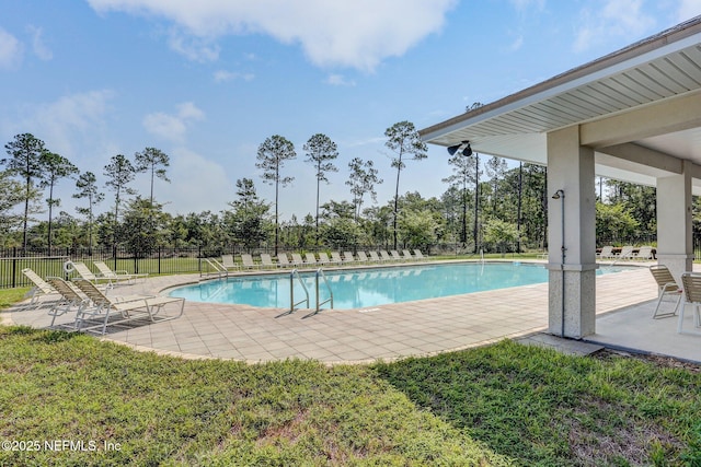 86051 Venetian Ave, Yulee, FL 32097 - community pool with a patio and view of scattered trees