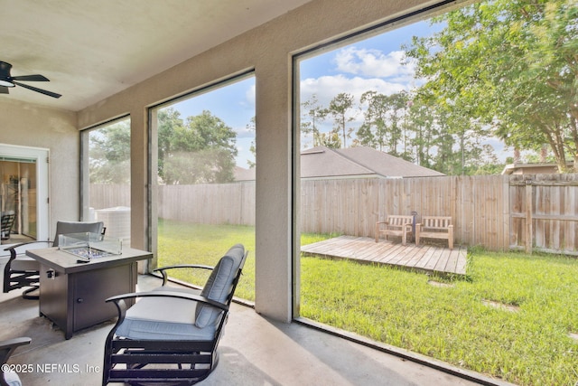 86051 Venetian Ave, Yulee, FL 32097 - sunroom with a fire pit and ceiling fan