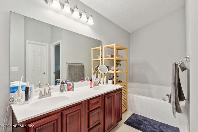 86051 Venetian Ave, Yulee, FL 32097 - bathroom with double vanity, a bath, a textured ceiling, and tile patterned floors