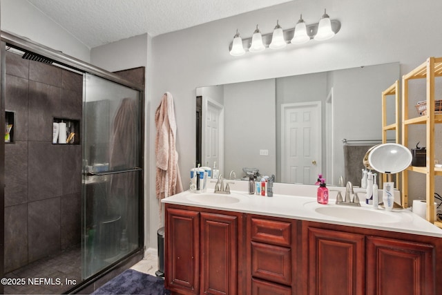 86051 Venetian Ave, Yulee, FL 32097 - bathroom featuring a stall shower, double vanity, and a textured ceiling