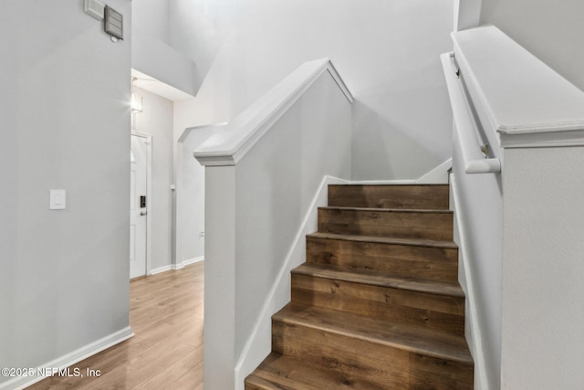86051 Venetian Ave, Yulee, FL 32097 - stairway featuring wood finished floors and baseboards