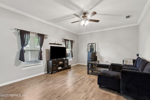 86051 Venetian Ave, Yulee, FL 32097 - living area with a ceiling fan, wood finished floors, a textured ceiling, and ornamental molding