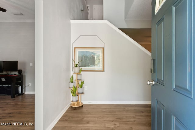 86051 Venetian Ave, Yulee, FL 32097 - entrance foyer featuring wood finished floors and crown molding
