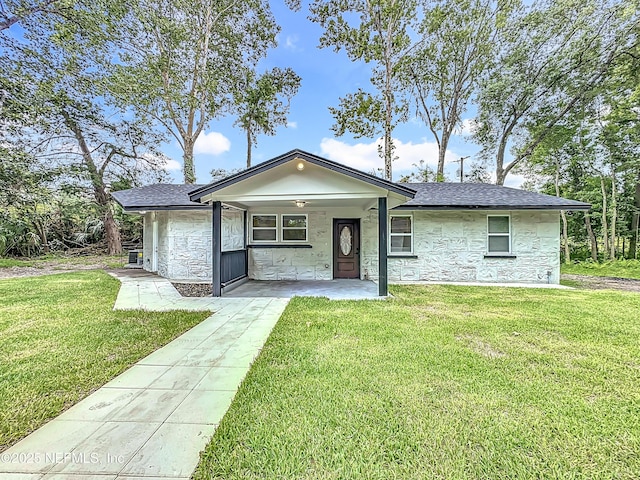540485 US Highway 1, Callahan, FL 32011 - ranch-style house with stone siding, a front lawn, and roof with shingles