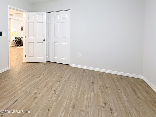540485 US Highway 1, Callahan, FL 32011 - unfurnished bedroom with light wood-style floors and a closet