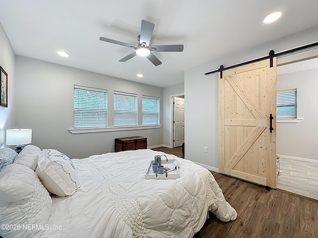 540485 US Highway 1, Callahan, FL 32011 - bedroom with a barn door, dark wood-type flooring, recessed lighting, and ceiling fan
